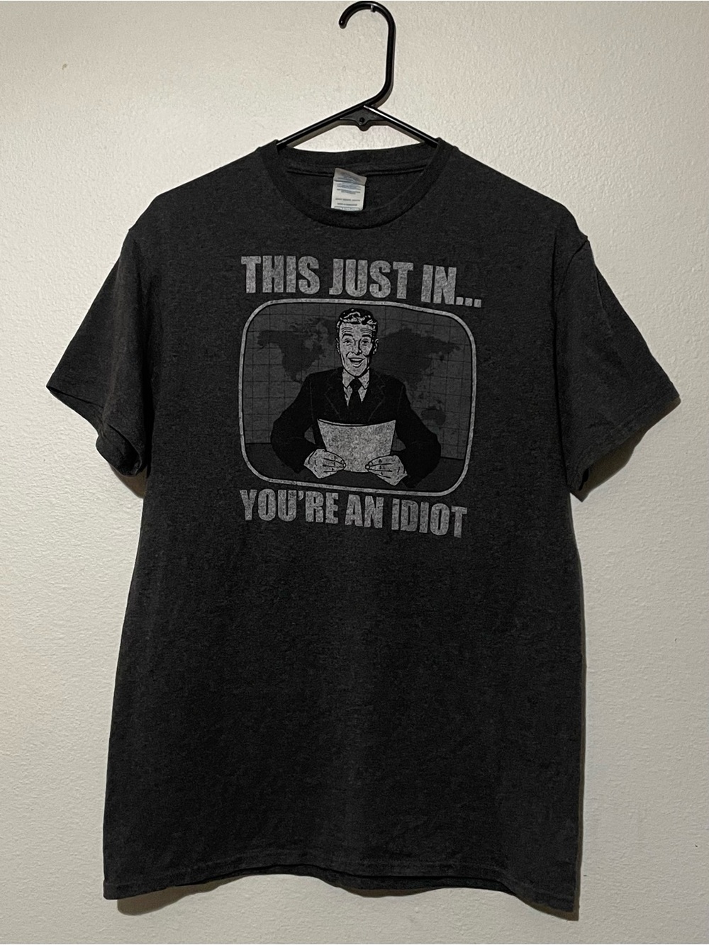 Delta Black Short-Sleeve Graphic Tee with Grey News Anchor Print